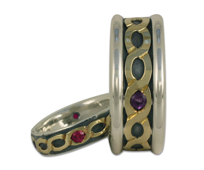 The rings in this his and hers matching wedding ring set have the same motif and coloration. 