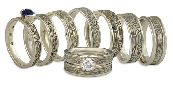These white gold engagement rings and wedding rings all feature the same motif, executed differently. As custom jewelers, we can always vary your ring in ways that suit you!